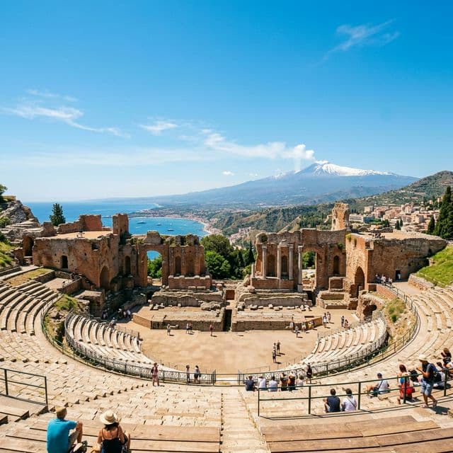 Ancient Greek Theatre of Taormina with Mount Etna and sea in the background